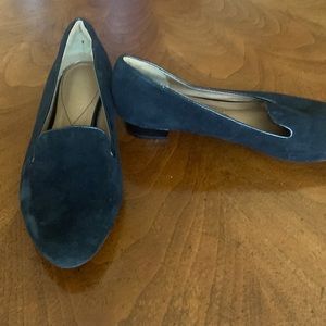 Oman. Black suede loafers with patent leather piping on heels and lips.